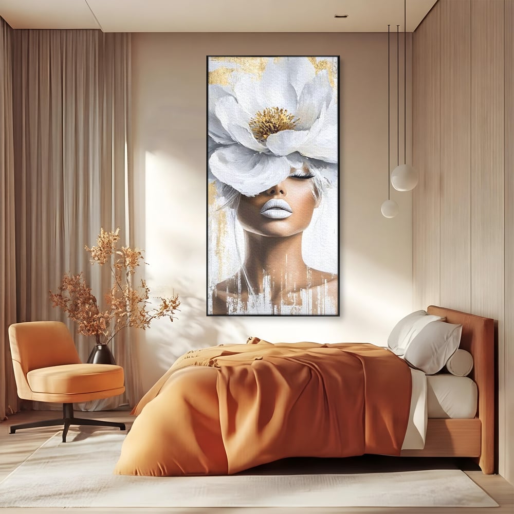 Tablou canvas cu tablou canvas cu portret de femeie si magnolie, in rama de aluminiu negru, pe perete intr-un dormitor